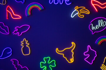 Colorful neon signs on dark background