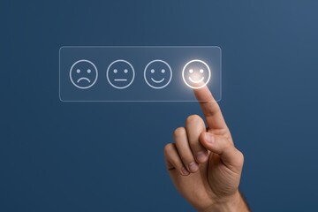 Customer feedback concept: Hand selecting happy face icon on digital interface for excellent service