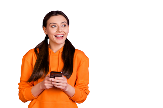 Portrait of dreamy curious positive millennial girl with pigtails ponytails use mobile phone type post for blog  wear sportive hood sweater modern outfit isolated over violet purple color background