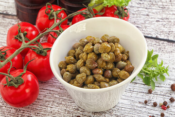 Marinated green capers in the bowl