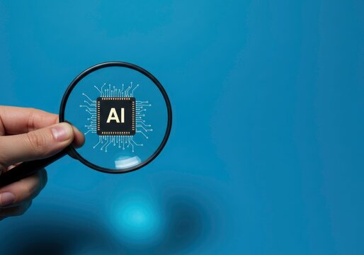 A magnifying glass held by a hand reveals a black chip with the letters AI on it against a blue background