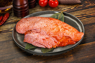 Raw marinated duck breast for cooking