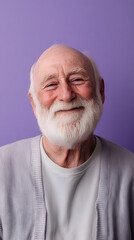portrait of a smiling elderly man with a full white beard - conveying the wisdom vertical - purple background