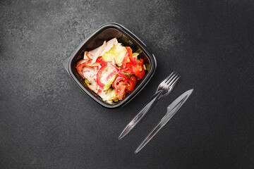 Turkey salad with lettuce tomato red pepper and parmesan cheese for healthy lunch or protein diet concept