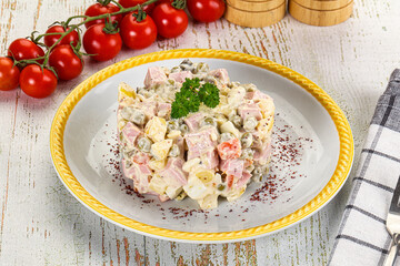 Russian traditional Olivier salad with sausages