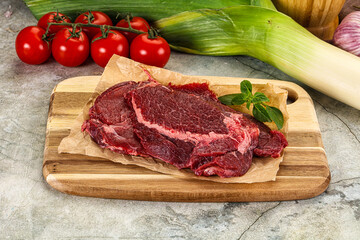 Raw beef cheeks cut for cooking