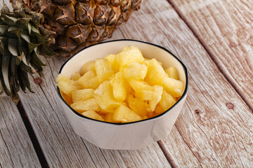 Sweet canned pineapple fruit pieces