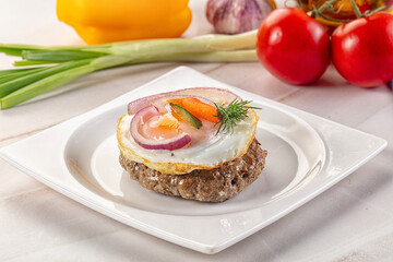 Beefsteak chop with roasted egg