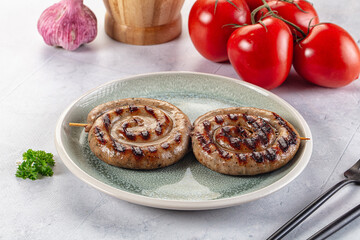 Grilled beef round circle sausages