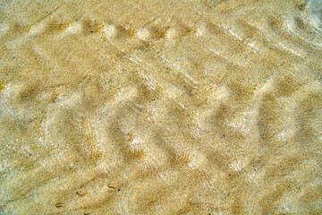 Texture of sand wave under clear water sea