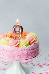 Celebration cake with candle for a child's ninth birthday party