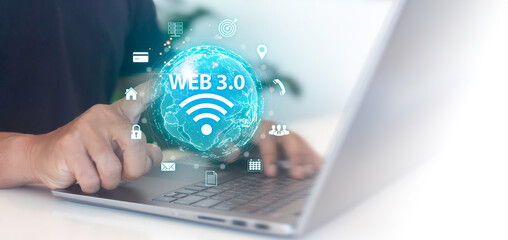 A man is using a laptop and using Web 3.0 technology on a virtual screen.