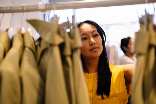 Woman shopping in ia clothing store