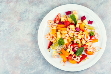 Plate of shrimp fruits salad, food photography.