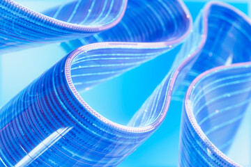 Curved 3d digital data stream circuit on blue abstract background