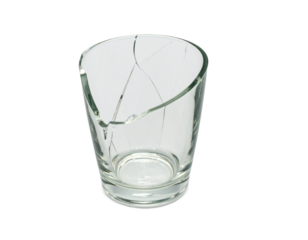 A cracked glass cup, isolated on a white background, perfect for use in themes of damage, fragility, or household accidents.