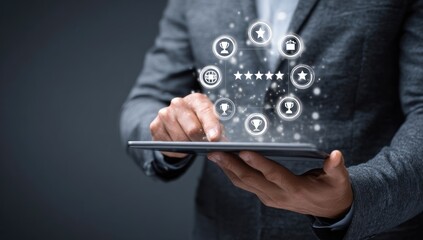 Person using tablet with glowing, abstract icons of achievement