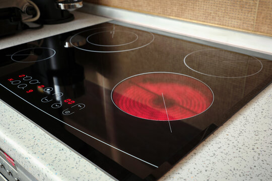 Heated electric stove coils cooktop in home kitchen. Preparing to cook food.