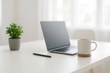 Laptop mug plant pen on desk image