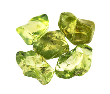 few natural tumbled peridot crystals cutout
