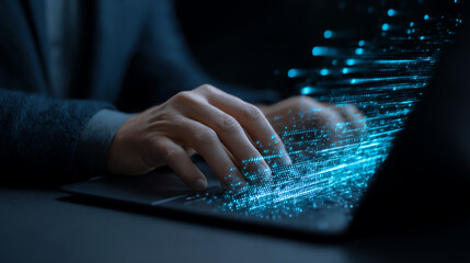 Person typing on a laptop keyboard with digital data streams flowing from the keys, symbolizing coding, programming, or cybersecurity in a dark environment