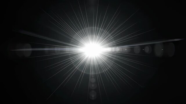 Abstract bright light ray burst with lens flare effect radiating across a dark background. Optical light leak. footage.