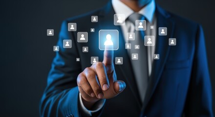 Businessman Touching Virtual Human Resources Interface: Recruitment, Networking, and Digital Transformation Concept on Dark Background