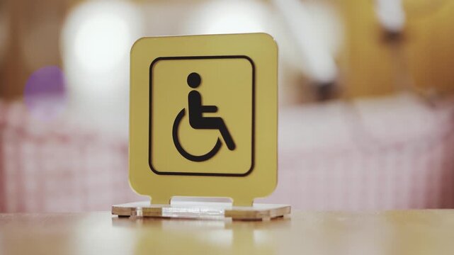 Yellow Sign Indicating Accessibility for Disabled Persons with Wheelchair Icon Design