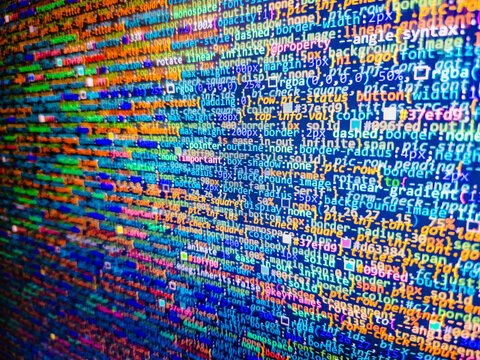Innovative startup project. Desktop PC monitor photo. Lots of digits on the computer screen. Python code computer screen. Website HTML Code on the Laptop Display Closeup Photo