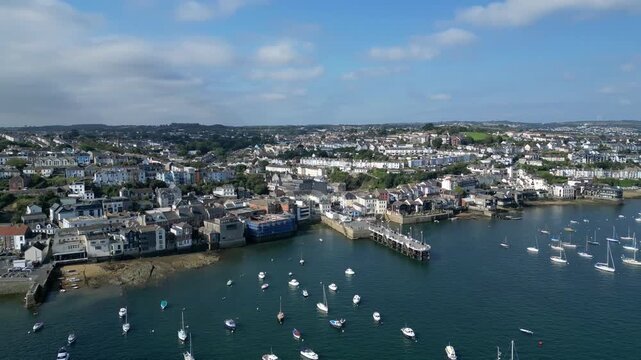 Falmouth, Cornwall, England: DRONE VIEWS: The town of Falmouth and the St Mawes ferry quay with moored yachts on the River Fal. Falmouth is a popular UK holiday destination and port town (Clip 3).