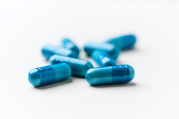 Amino acids capsules on bright background. Soft focus. Close up. Copy space.	