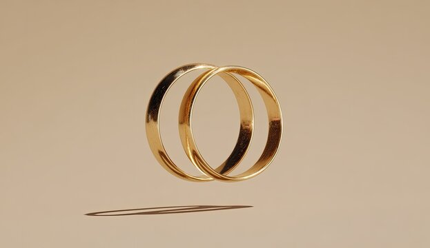 Golden wedding rings, floating, beige background, minimalist style, engagement announcement - Powered by Adobe