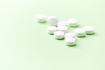 Hyaluronic acid tablets. Hyaluronic acid helps skin stretch and flex and reduces skin wrinkles. Bright paper background. Soft focus. Close up. Copy space	