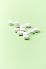 Hyaluronic acid tablets. Hyaluronic acid helps skin stretch and flex and reduces skin wrinkles. Bright paper background. Soft focus. Close up. Copy space	