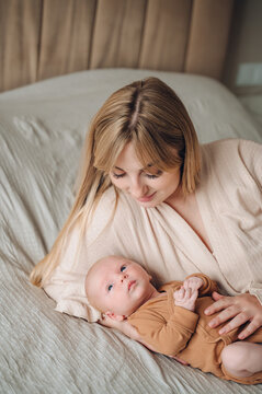 Mother and newborn bonding in serene indoor setting