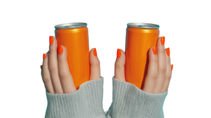 Stylish orange soda presentation featuring a pair of hands and metallic cans