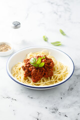 Traditional spaghetti Bolognese with fresh basil