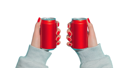 Hands Holding Red Soda Cans against a Black Background for Refreshment Theme