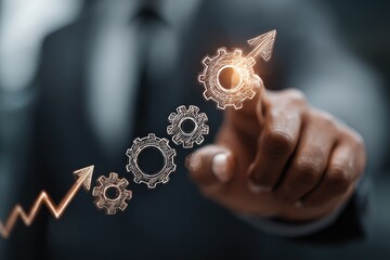 Hand points to upward trending gears (1)