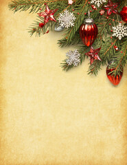 Fir branch with red Christmas ornaments and snowflakes on  aged paper background. Vintage  Christmas and New Year holidays background.  Flat lay.