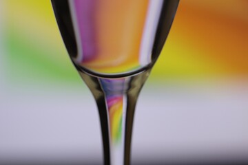 Close-Up of a Glass Against a Vibrant Multicolored Background