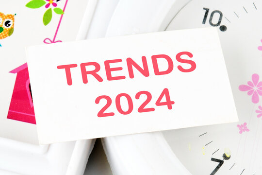 The evaluation methods, popular topics, and new trends in business. TRENDS 2024 written on a white card