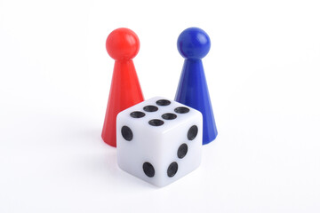 Blue and red board game figures and dice isolated on white background