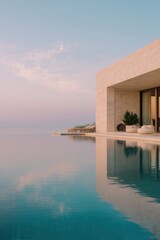 Obraz premium Elegant minimalist seaside villa with a flat roof overlooking tranquil waters at sunset