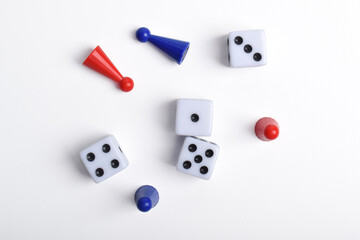 Board game figures and dice isolated on white background