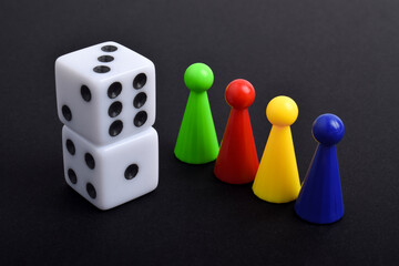 Colorful crowd and dice isolated on black background