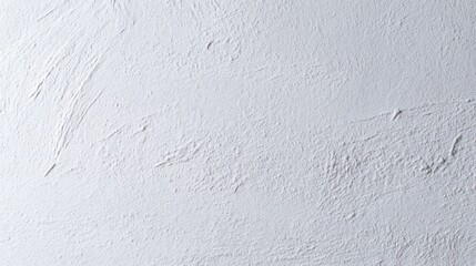 An off-white textured wall with rough patches and streaks showcasing tactile qualities, depth,