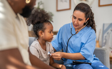 Doctor using stethoscope for medical checkup, listening to heartbeat and lungs of african child,...
