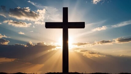 Wooden cross silhouette against a bright sunburst with dramatic clouds and blue sky backdrop symbolizing faith, hope, and religion.