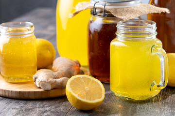 Colorful Kombucha Jars and Bottles on wooden table	